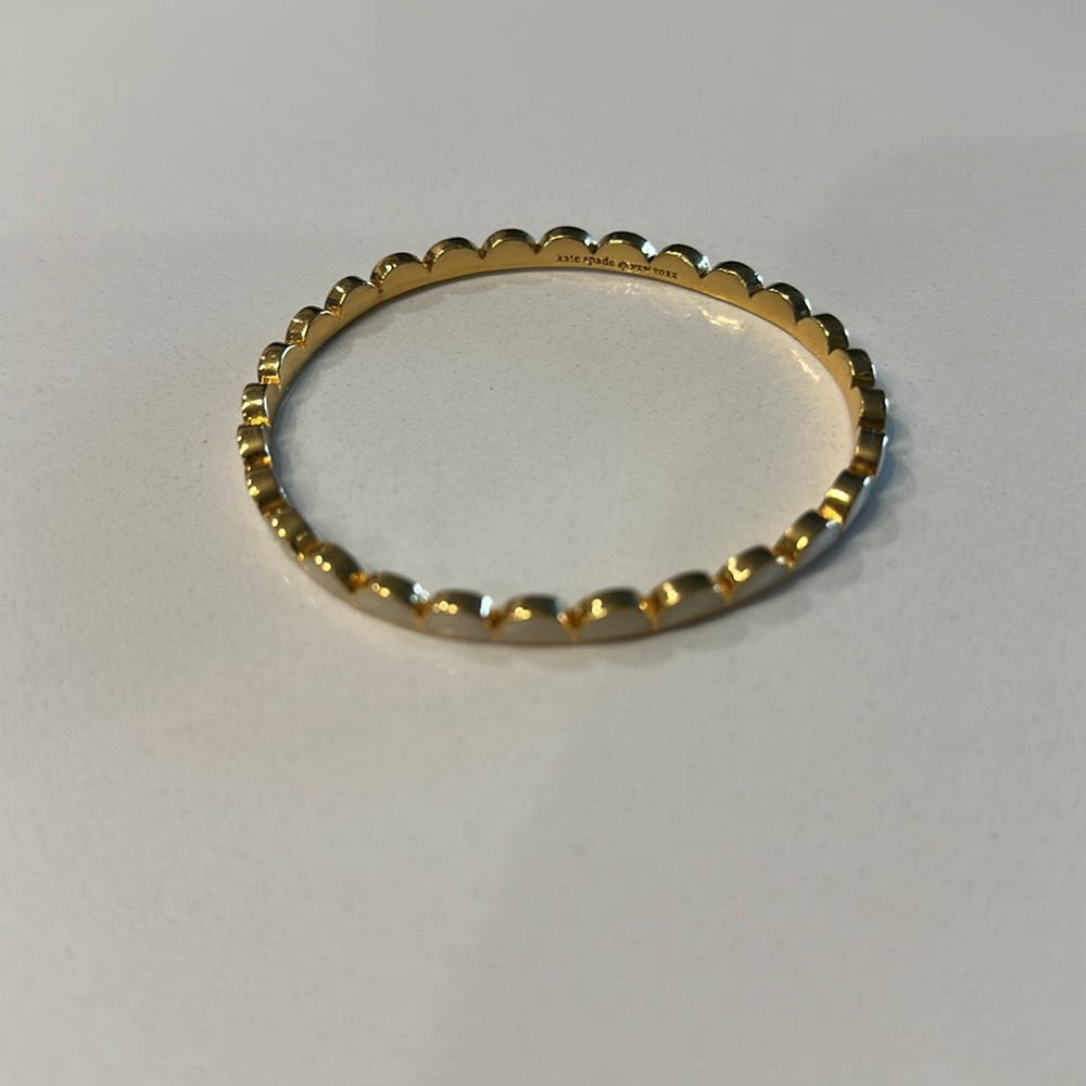 Kate Spade New York cream with gold accents scallop bangle